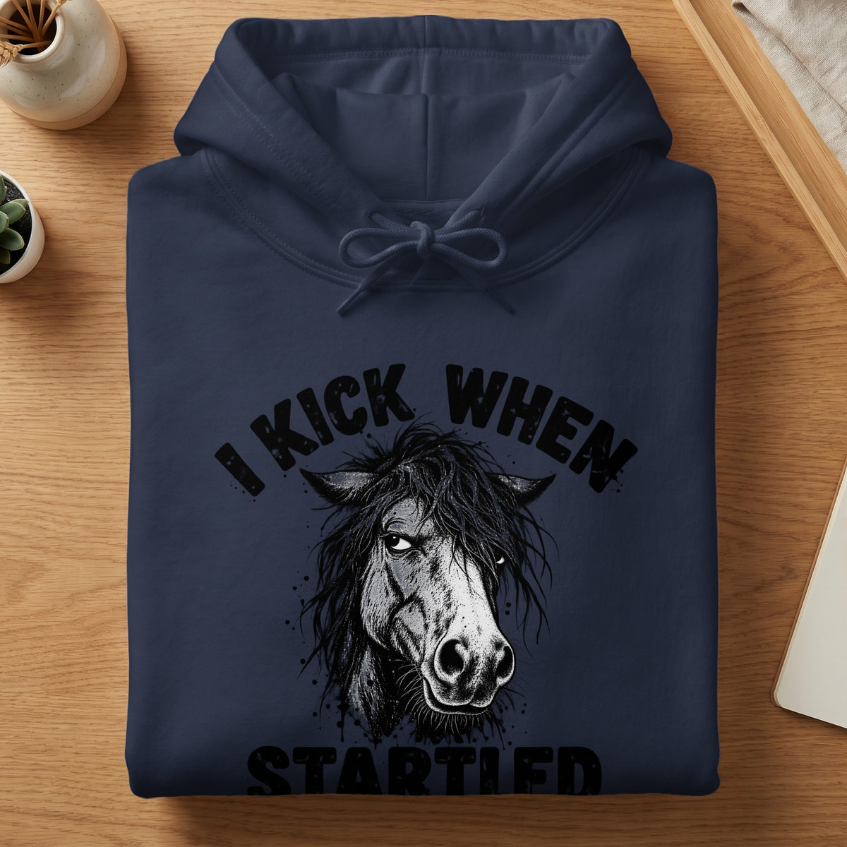 Navy hoodie with distressed horse graphic and text "I KICK WHEN STARTLED".