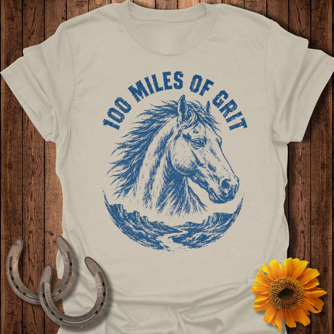 T-shirt with blue horse head and "100 Miles of Grit" text.