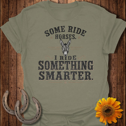 Olive t-shirt with text: "Some Ride Horses. I Ride Something Smarter." and a donkey graphic.