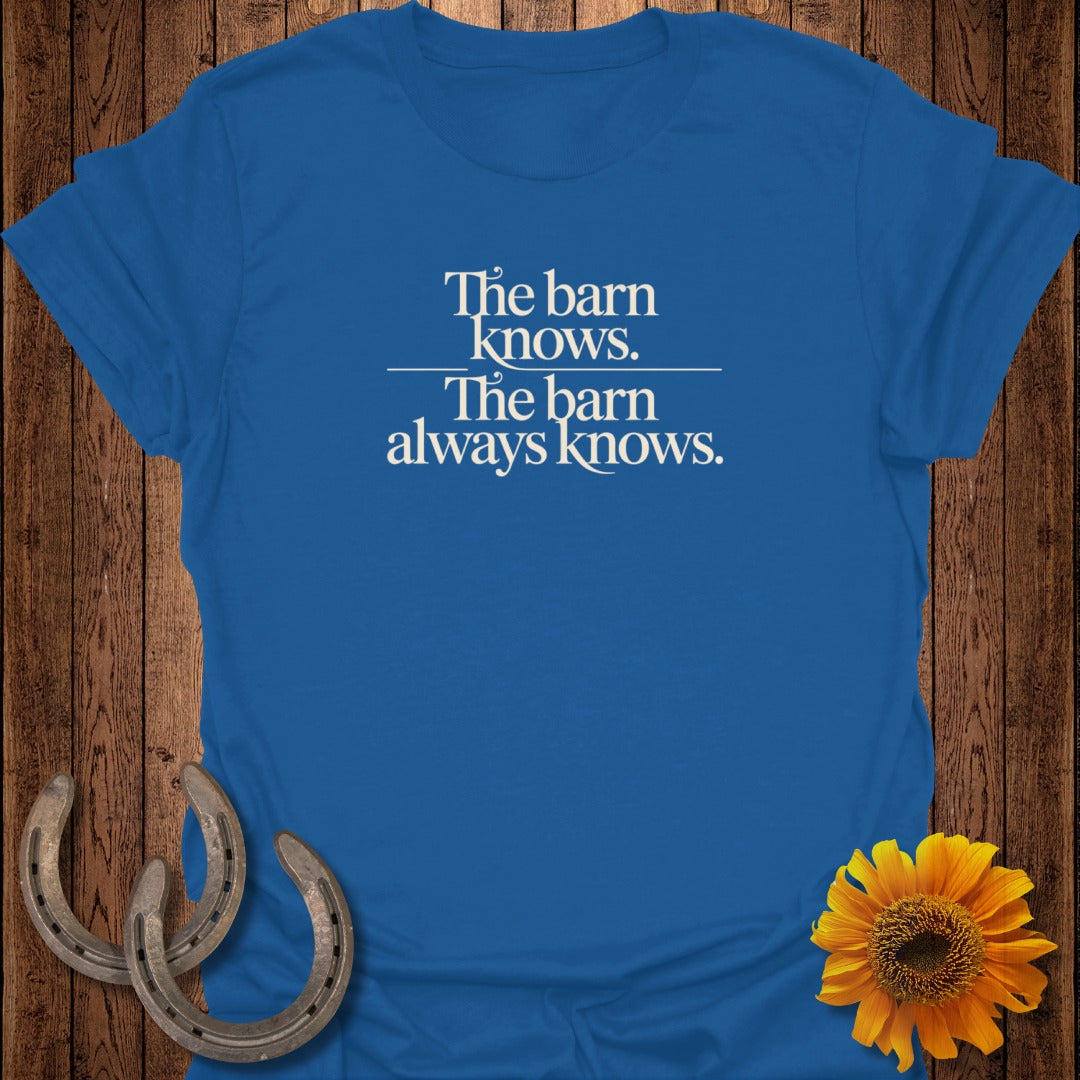 Blue t-shirt with text "The barn knows. The barn always knows."
