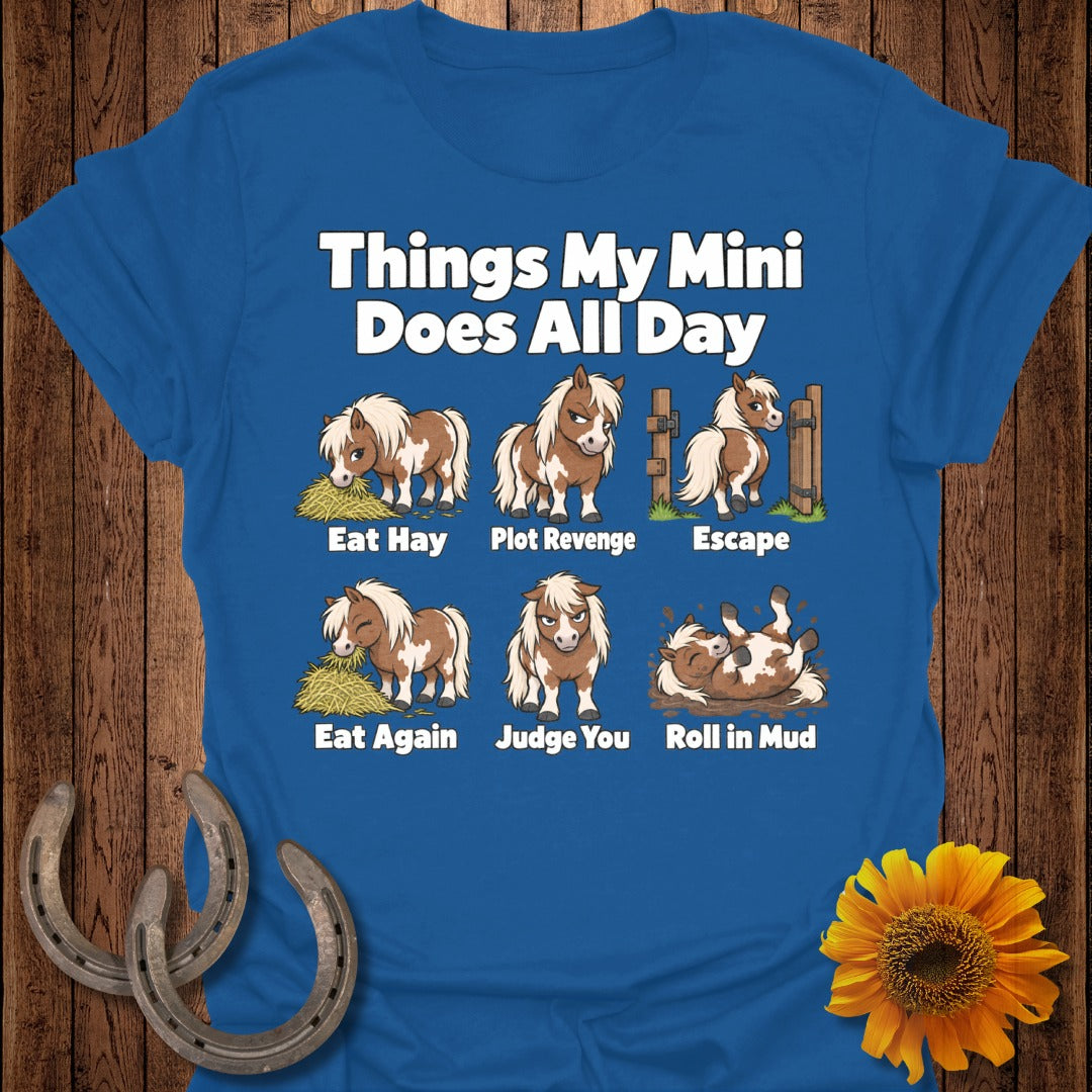 Blue t-shirt with cartoon ponies: Eat Hay, Plot Revenge, Escape, Eat Again, Judge You, Roll in Mud.