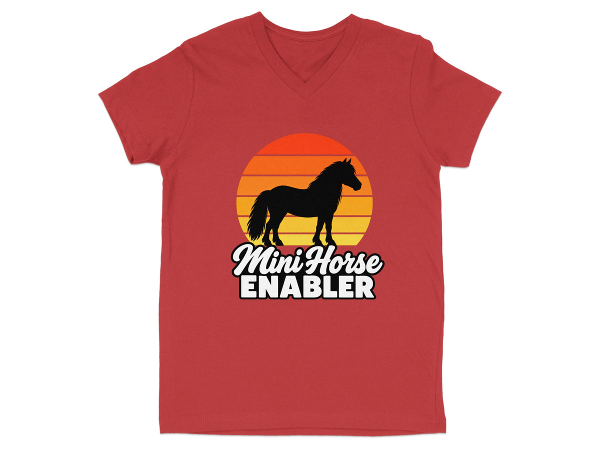 A red V-neck t-shirt featuring a silhouette of a horse against a sunset graphic and text reading Mini Horse ENABLER.