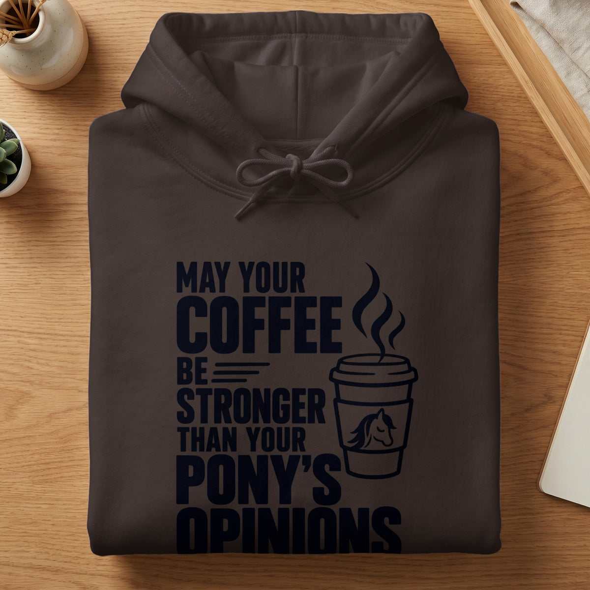 Dark brown hoodie with "May your coffee be stronger than your pony's opinions" text and coffee cup graphic.