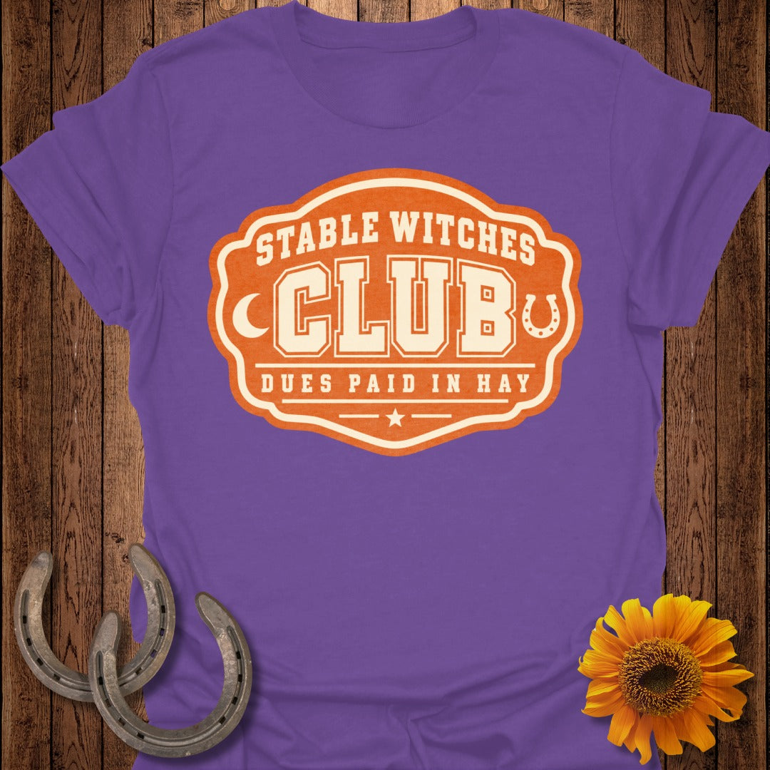 Purple t-shirt with "Stable Witches Club" and "Dues Paid In Hay" text.