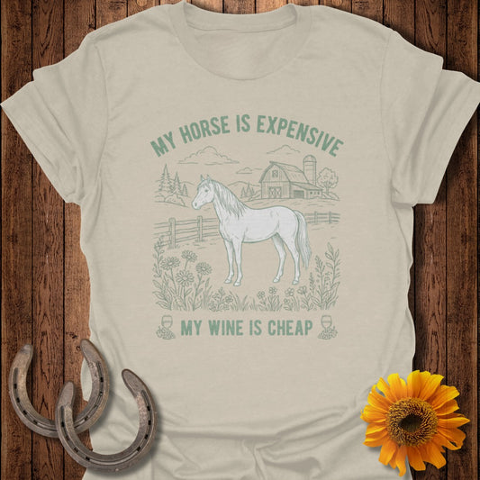 T-shirt with a drawing of a horse in a field and the text "My horse is expensive, my wine is cheap."