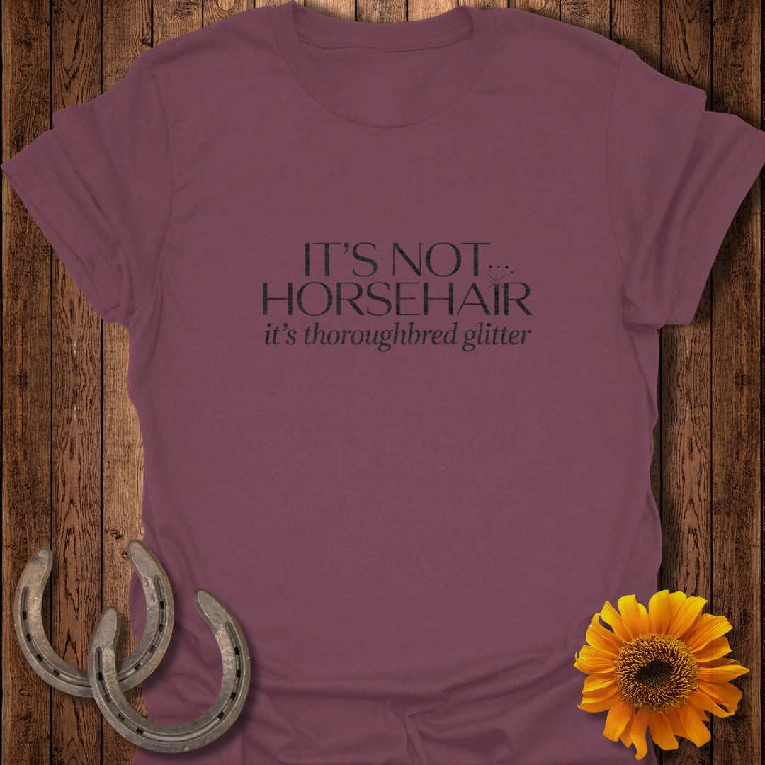 Maroon t-shirt with "IT'S NOT THOROUGHBRED it's thoroughbred glitter" text, horseshoes, and sunflower.