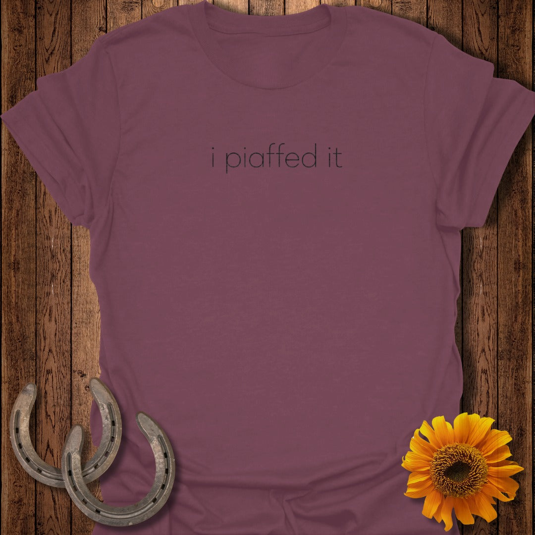 Maroon t-shirt with "i piaffed it" text, horseshoes, and sunflower.