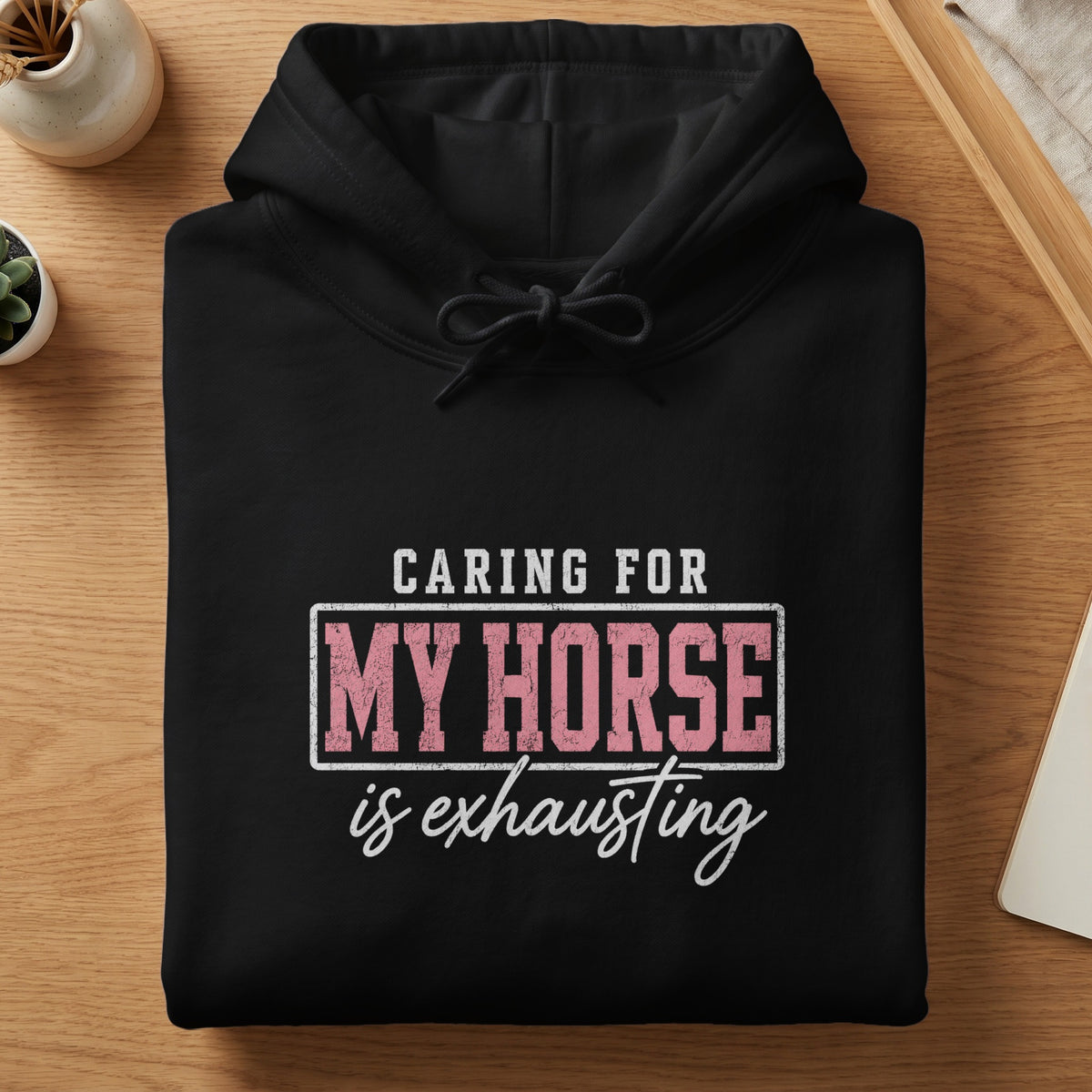 Black hoodie with text "Caring for My Horse is Exhausting".