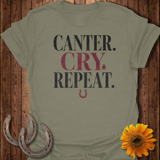 Olive t-shirt with "Canter. Cry. Repeat." text and horseshoe graphic.