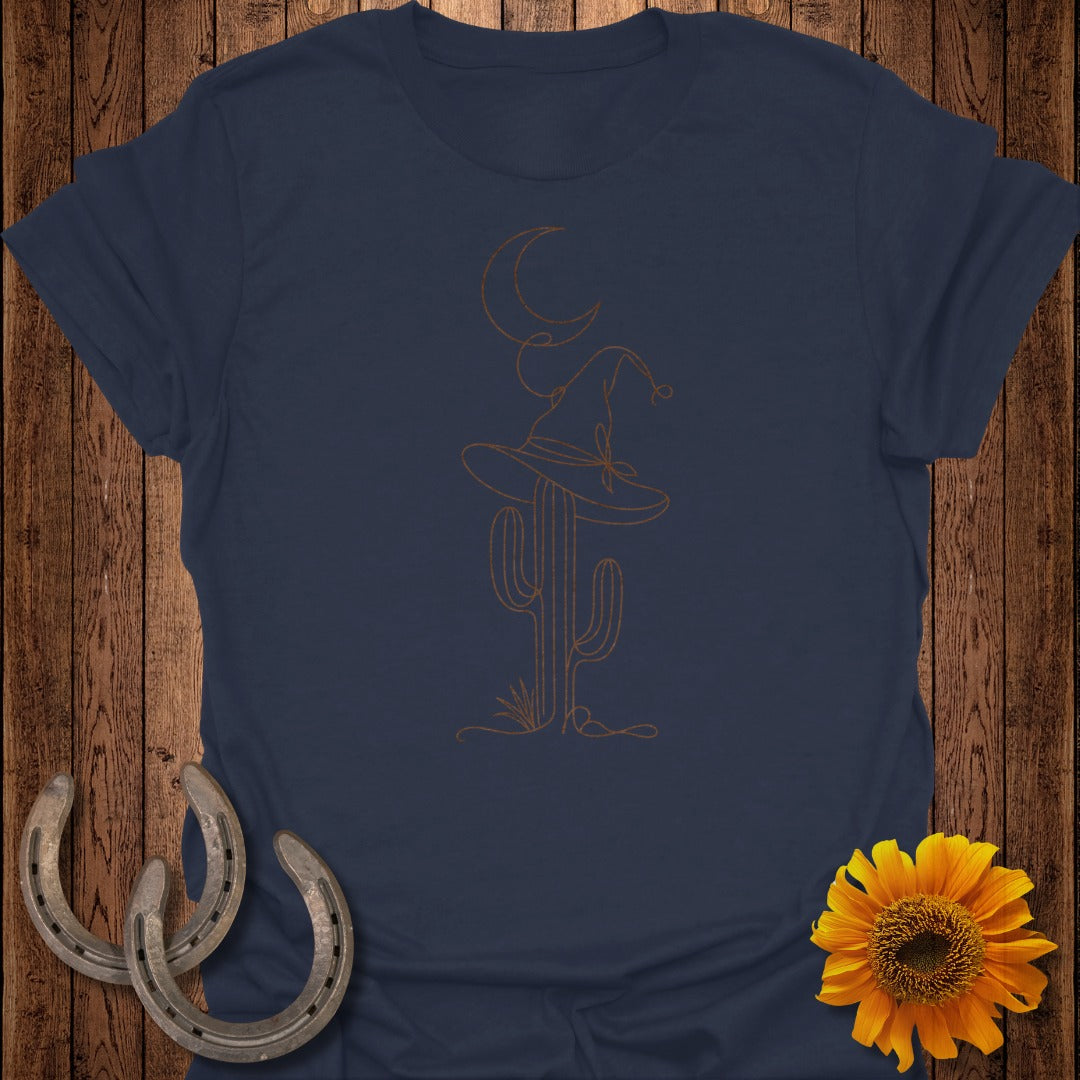 Dark blue t-shirt with a line art design of a cactus, witch hat, and moon.