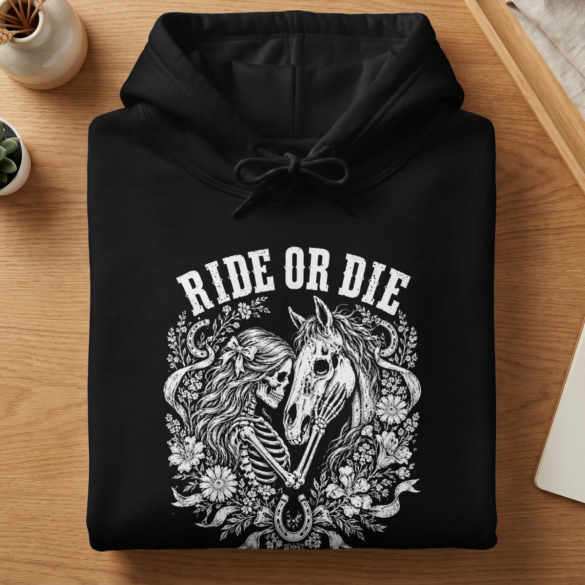 Black hoodie with "Ride or Die" text and skeleton and horse illustration.