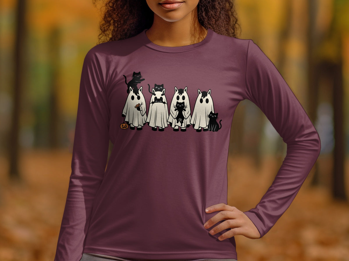 Black cats in ghost costumes with a pumpkin and candy graphic on a maroon long-sleeve shirt.