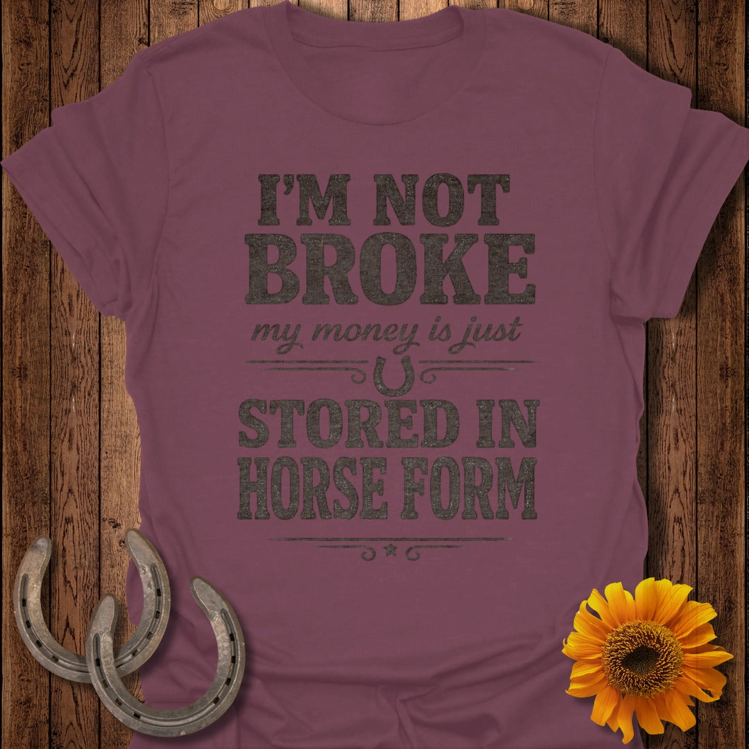 Maroon t-shirt with text "I'm not broke, my money is just stored in horse form."