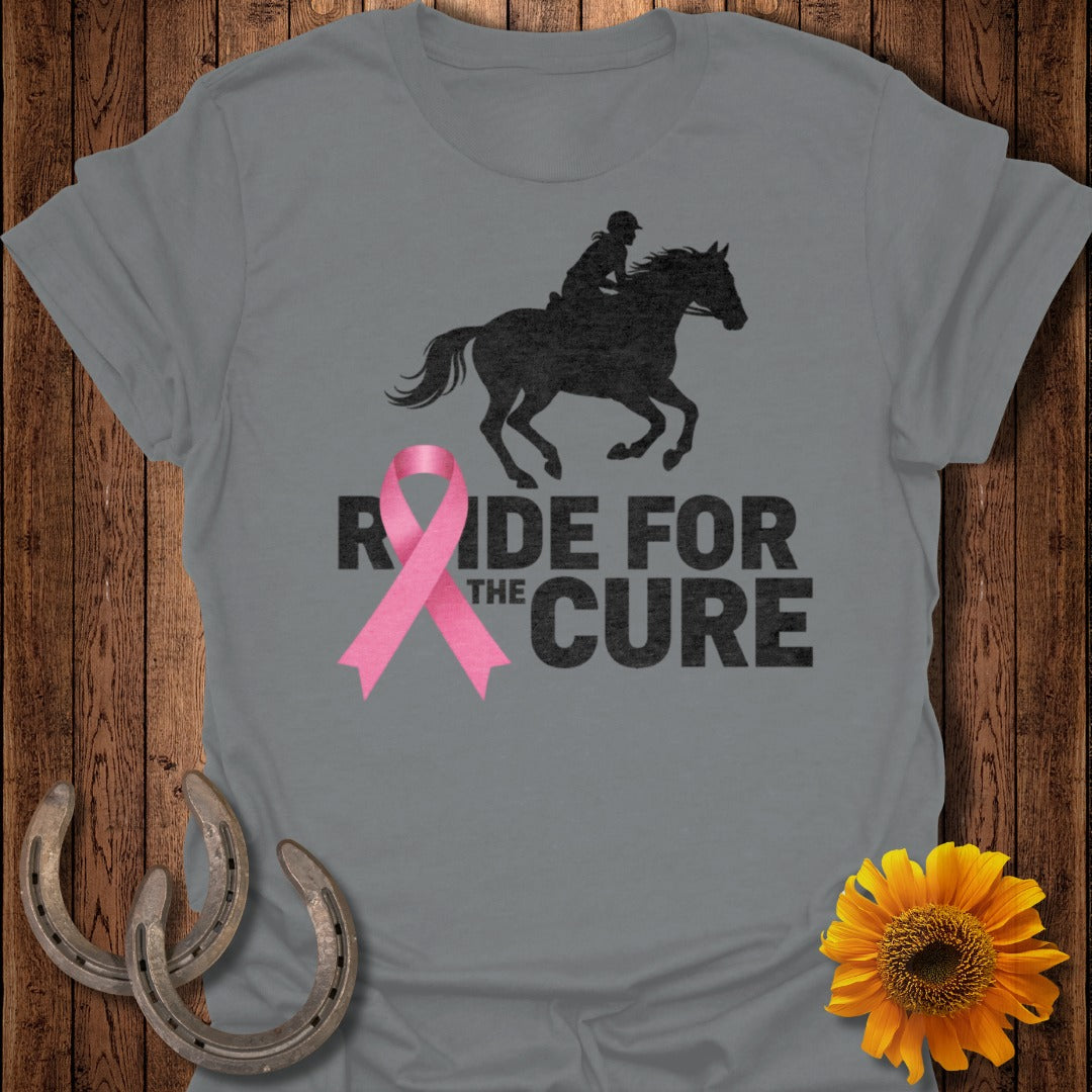 Grey t-shirt with black silhouette of horse and rider and pink ribbon.