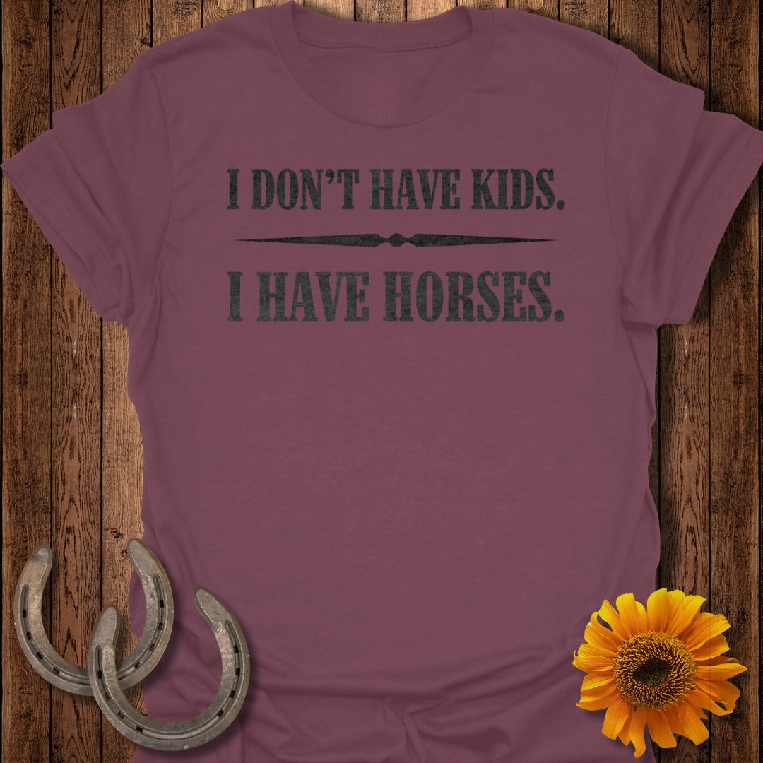 Maroon t-shirt with text "I DON'T HAVE KIDS. I HAVE HORSES."