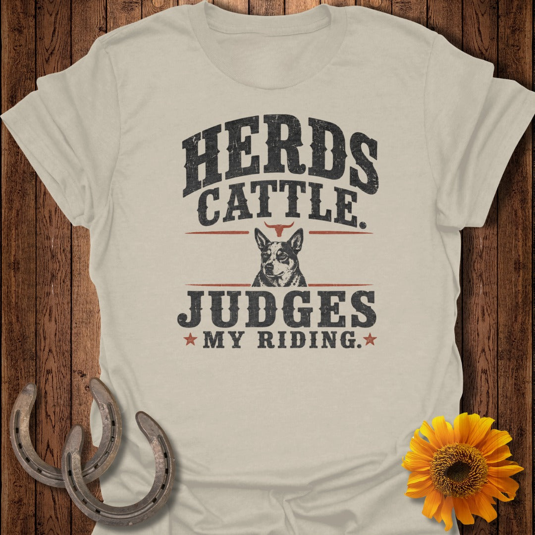 Shirt with text: Herds Cattle Judges My Riding and a dog portrait.
