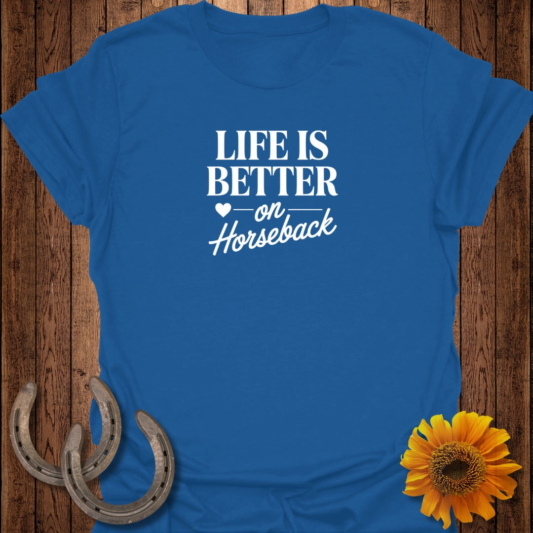 Blue t-shirt with white text "Life is Better on Horseback".