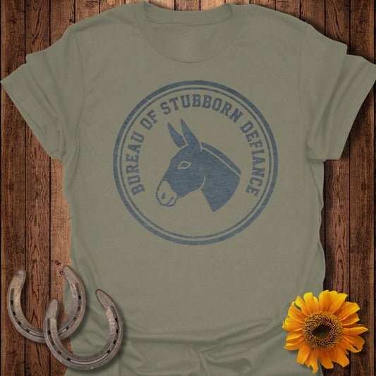 Grey t-shirt with "Bureau of Stubborn Defiance" and donkey head logo.