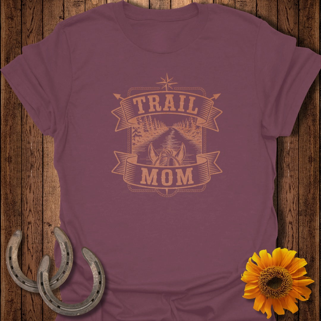 Maroon t-shirt with "Trail Mom" text and nature graphic.