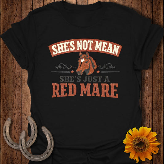 Black t-shirt with a horse graphic and text "SHE'S NOT MEAN SHE'S JUST A RED MARE".