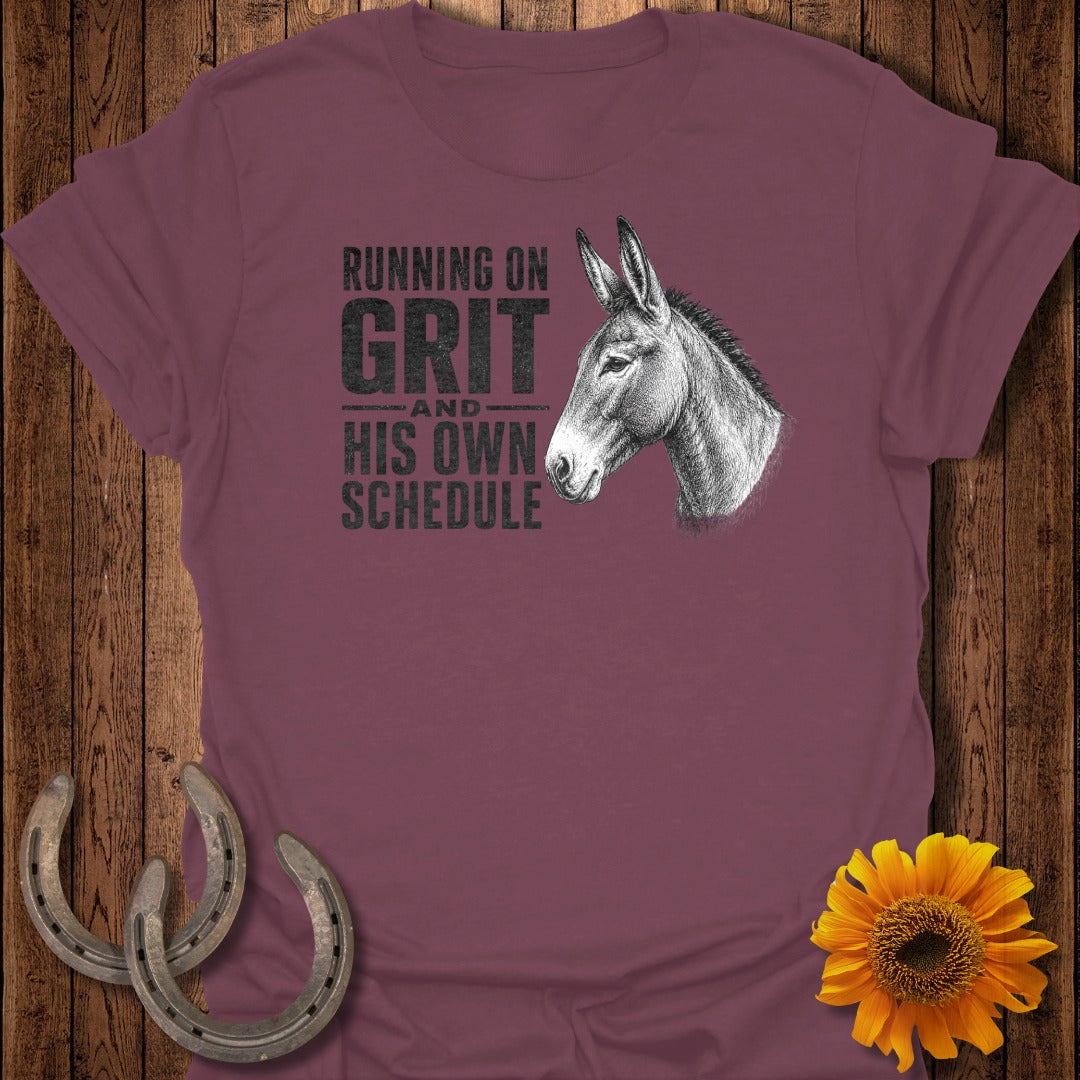 Maroon t-shirt with donkey graphic and text: "Running on Grit and His Own Schedule."
