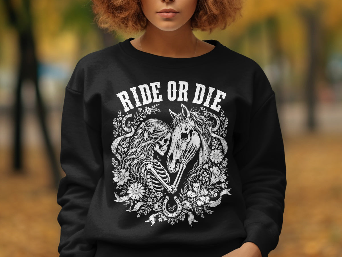 Black sweatshirt with white "RIDE OR DIE" text and skeleton-horse graphic.