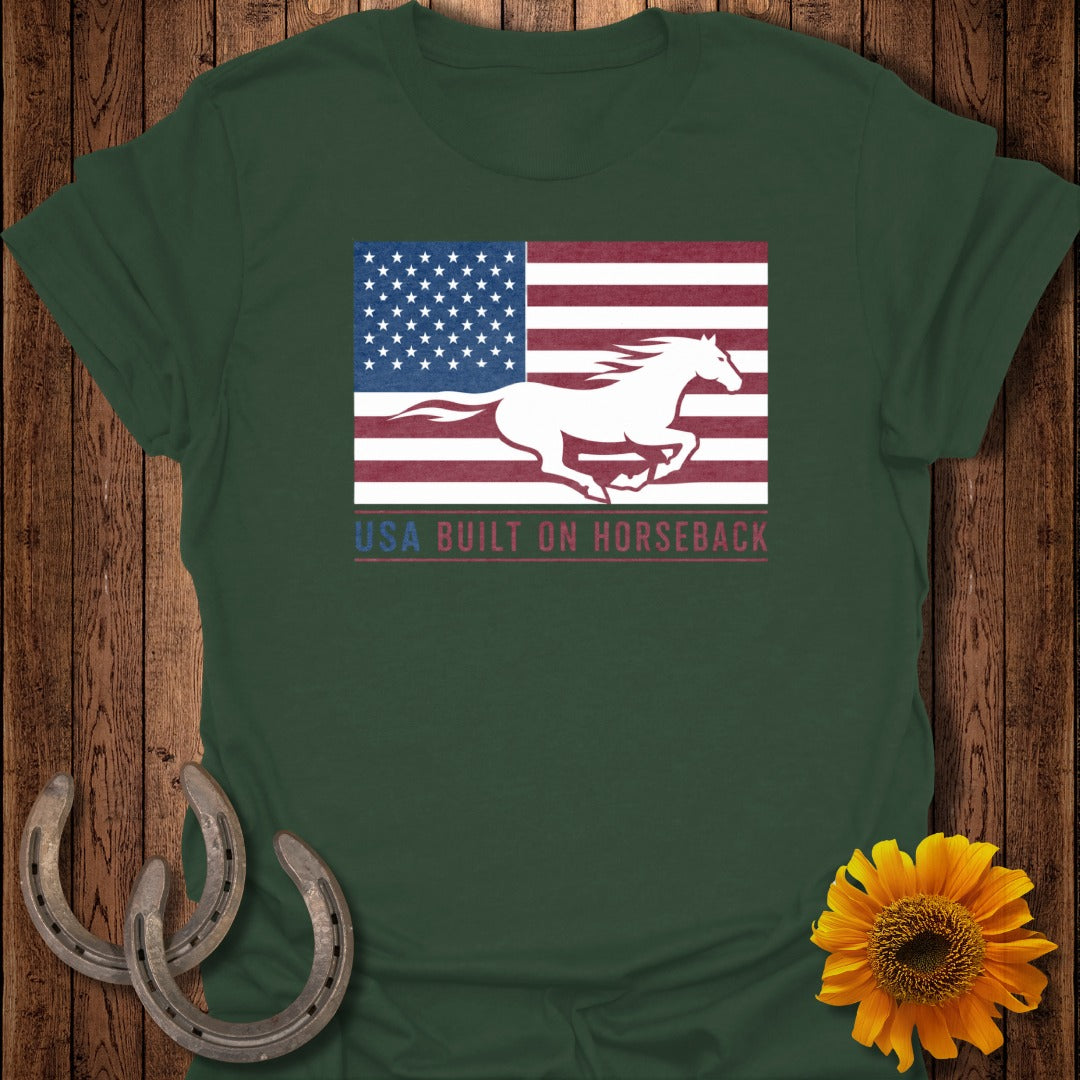 Green t-shirt with a white horse running across an American flag and text.