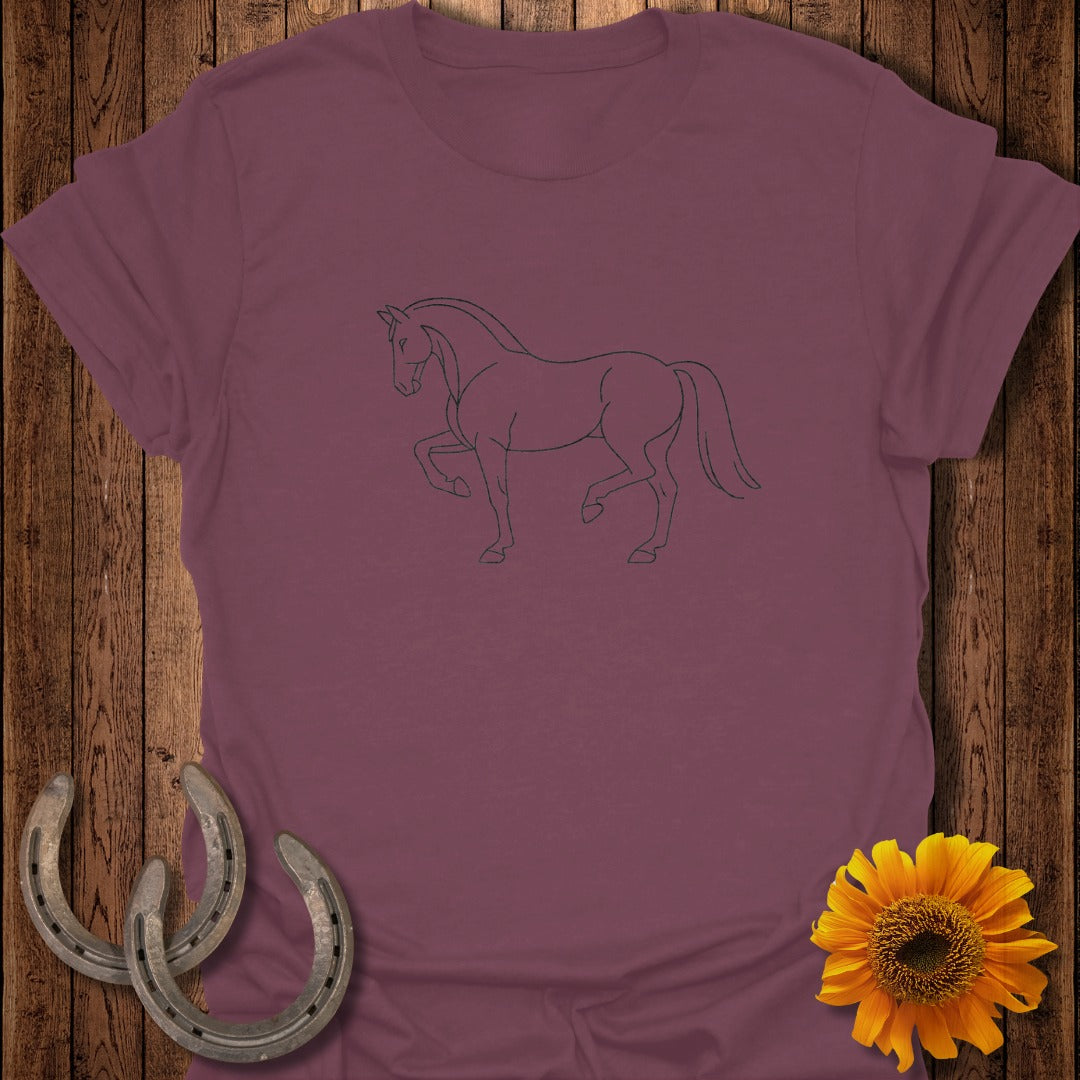 Maroon t-shirt with a black outline drawing of a horse, horseshoes, and a sunflower.