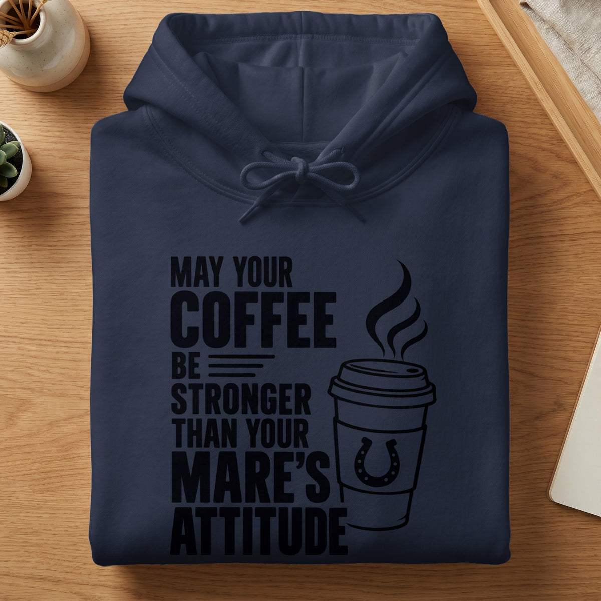 Navy blue hoodie with "May Your Coffee Be Stronger Than Your Mare's Attitude" text and coffee cup graphic.