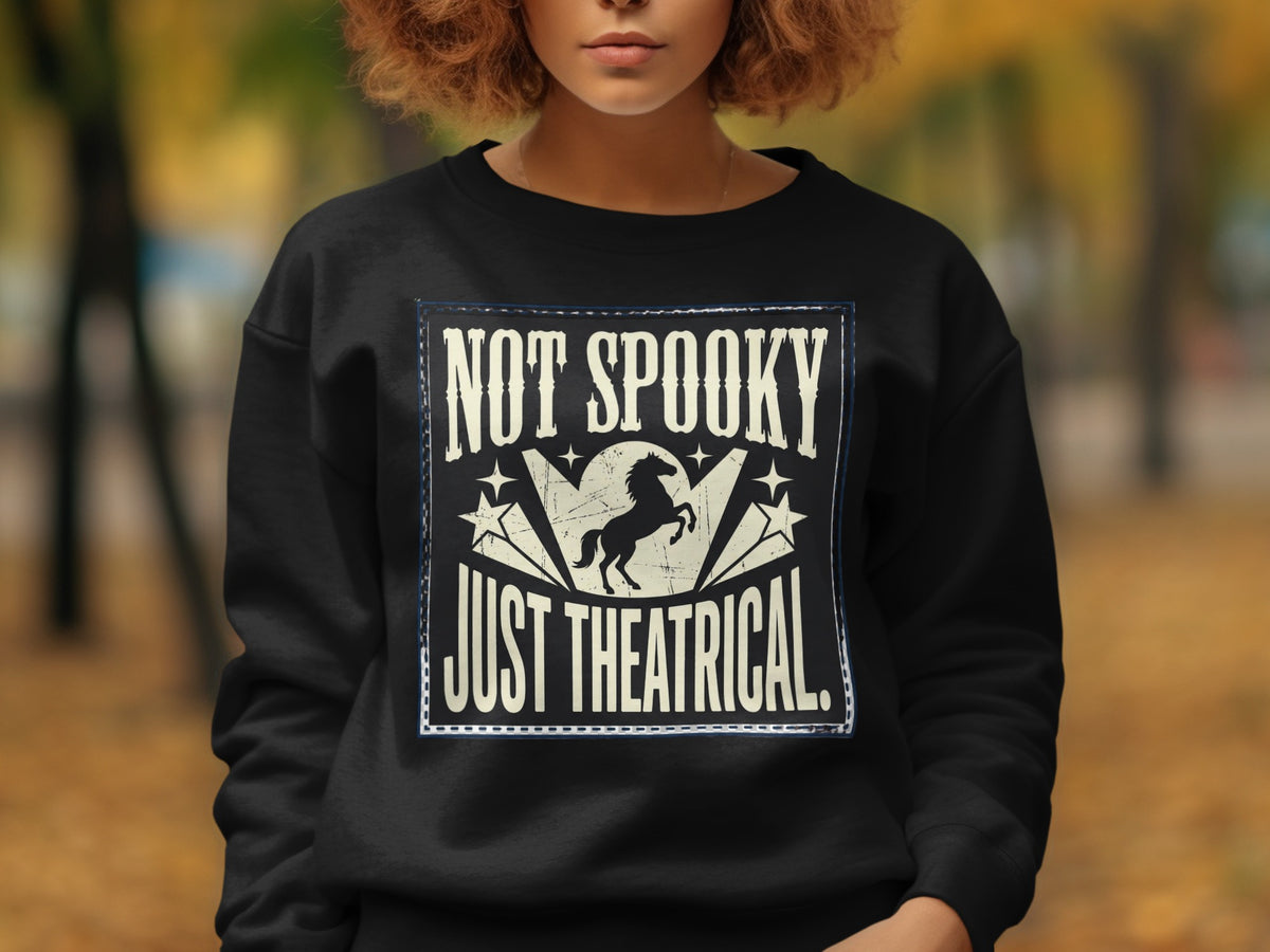 Black sweatshirt with "NOT SPOOKY JUST THEATRICAL" text and horse graphic.
