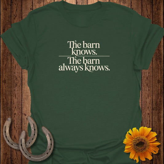 Dark green t-shirt with "The barn knows. The barn always knows." text.