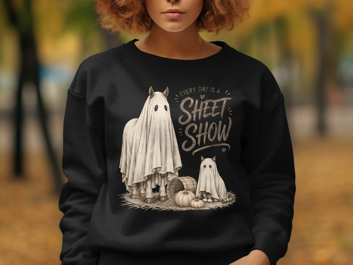 Horse and cat wearing ghost costumes with pumpkins and text "Every day is a sheet show."