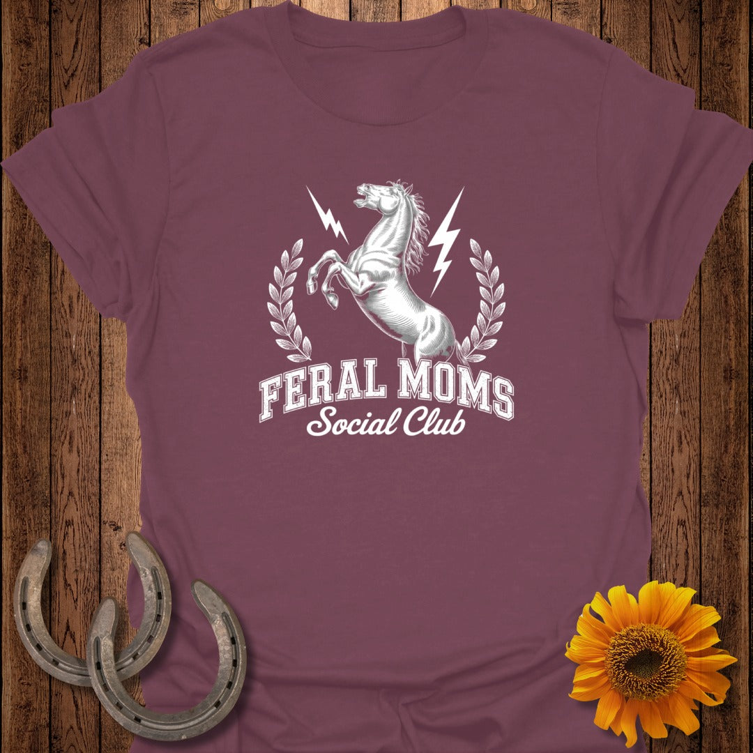 Burgundy t-shirt with silver horse graphic and "Feral Moms Social Club" text.