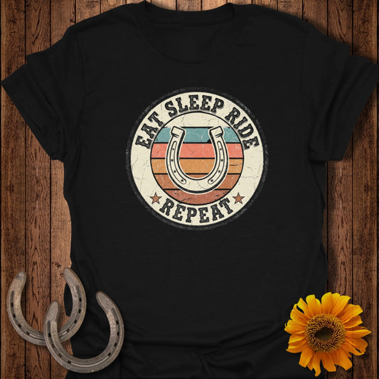 Horseshoe graphic with "Eat Sleep Ride Repeat" text on a t-shirt.