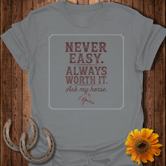 Grey t-shirt with "Never Easy. Always Worth It. Ask my horse." text and horse graphic.