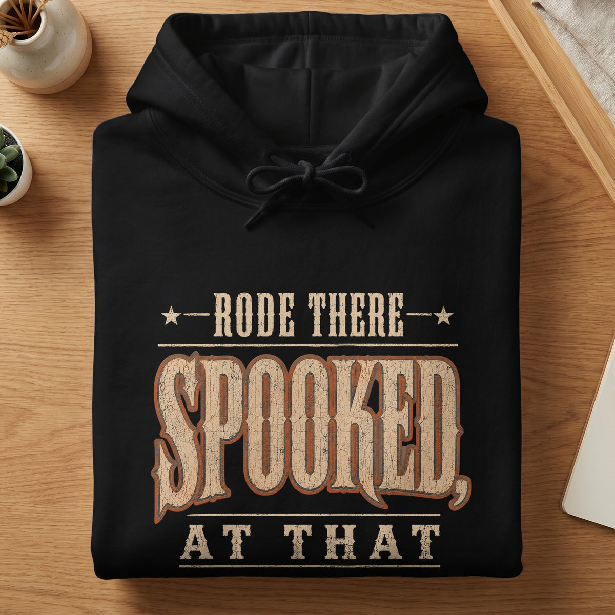 Black hoodie with distressed text "Rode There, Spooked At That"