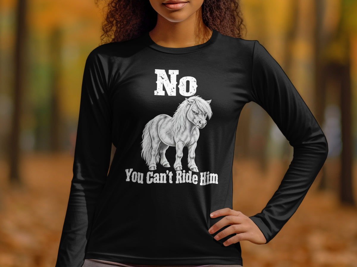 A person wearing a black long-sleeve t-shirt with a graphic of a pony and the text "No You Can't Ride Him".