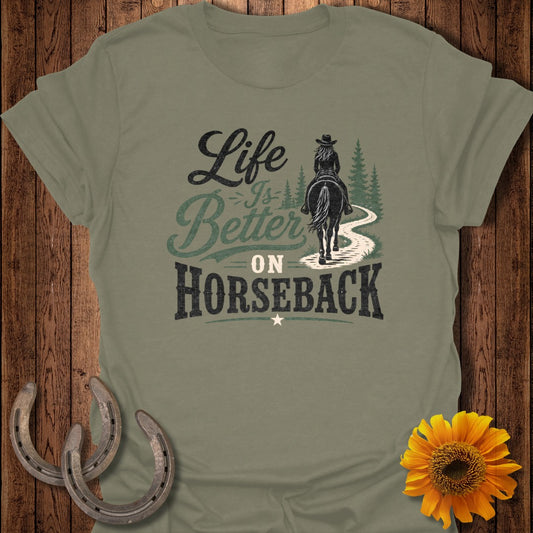 Olive green t-shirt with "Life is Better on Horseback" graphic and horseshoes and sunflower.