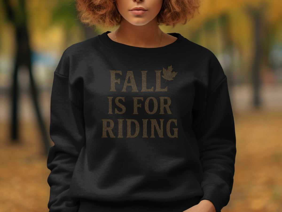 Black sweatshirt with "FALL IS FOR RIDING" text and a leaf graphic.