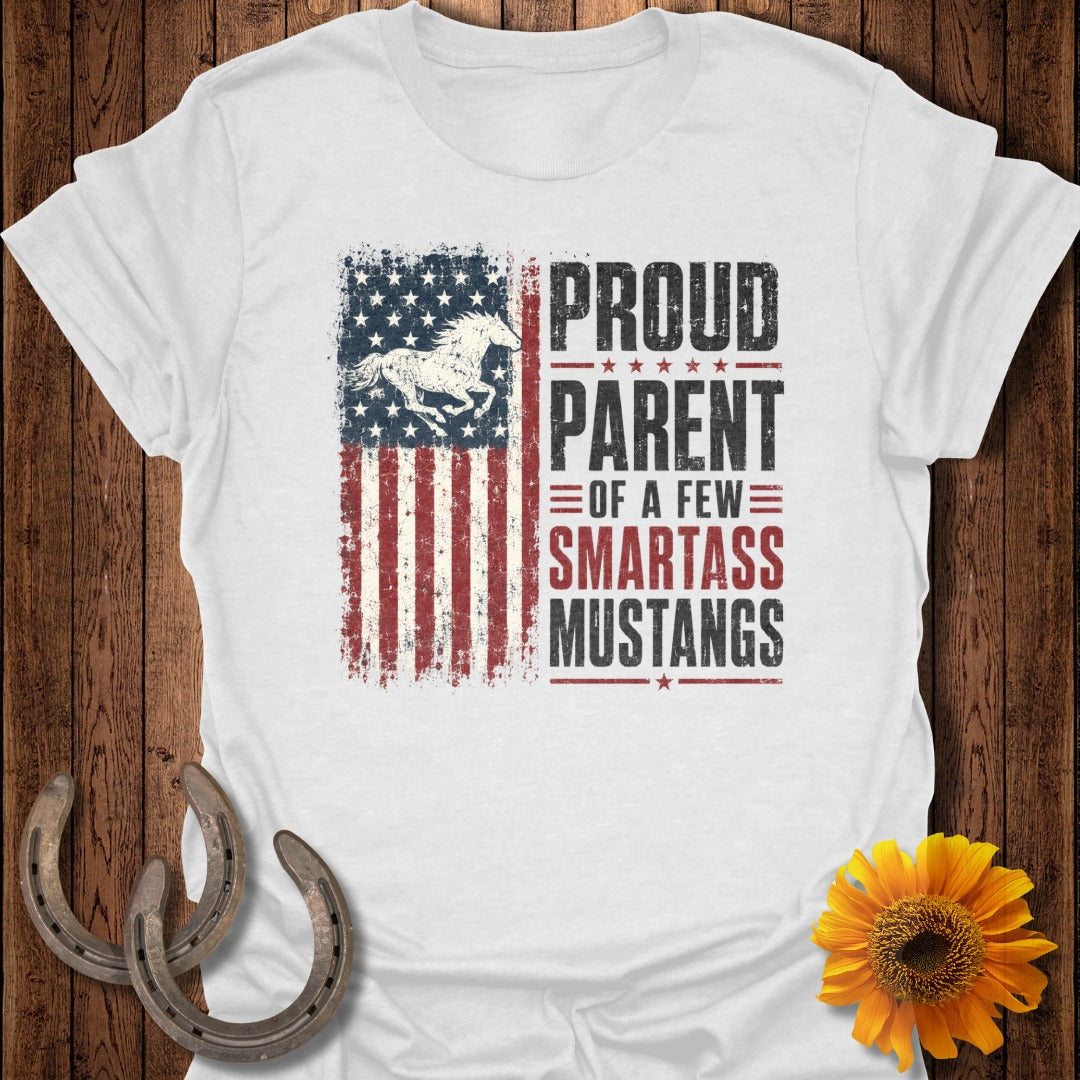White t-shirt with distressed American flag and text "Proud Parent of a few Smartass Mustangs".