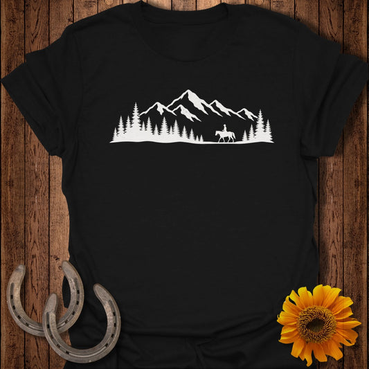 Black t-shirt with white silhouette of a rider and mountains among trees.