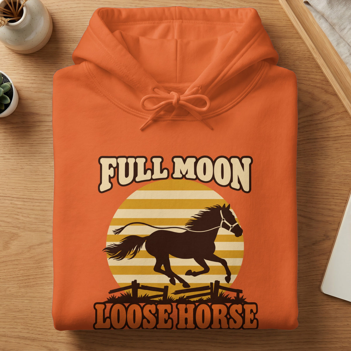 Orange hoodie with a "Full Moon Loose Horse" graphic featuring a running horse.