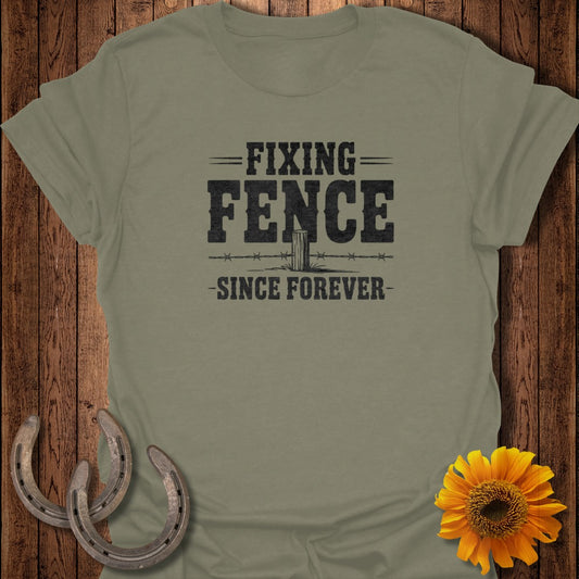 Olive green t-shirt with "Fixing Fence Since Forever" text and barbed wire graphic.