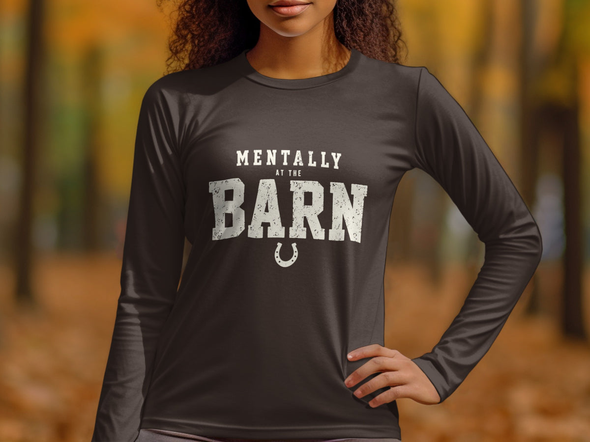 Dark long-sleeve shirt with "Mentally At The Barn" text and horseshoe graphic.