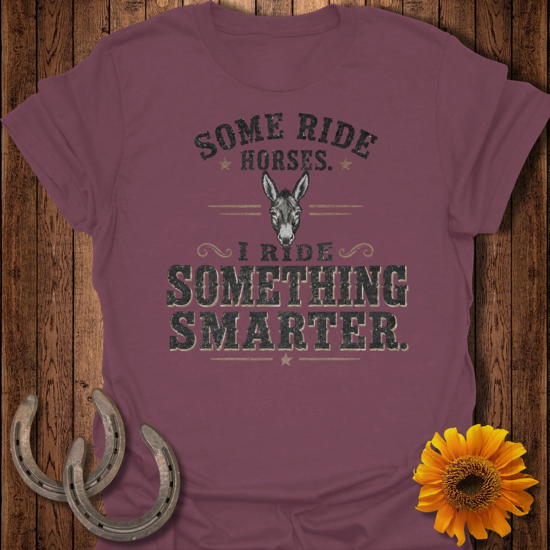 Maroon t-shirt with a donkey graphic and text "I ride something smarter."