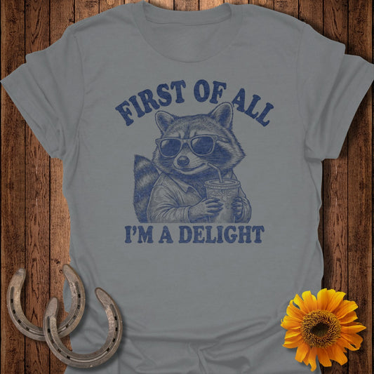 Raccoon wearing sunglasses holding a drink, text "FIRST OF ALL I'M A DELIGHT".