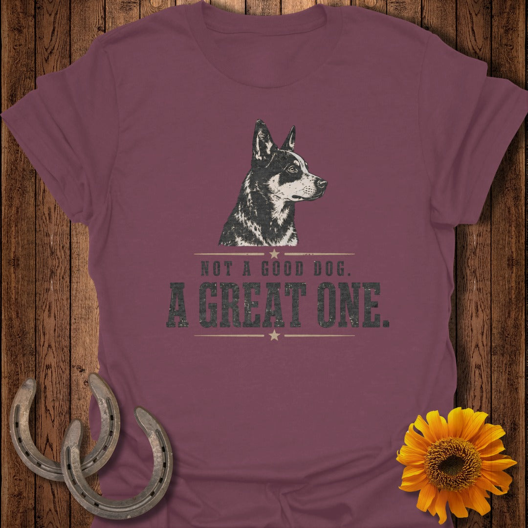 Burgundy t-shirt with black and white dog graphic and text "NOT A GOOD DOG. A GREAT ONE."