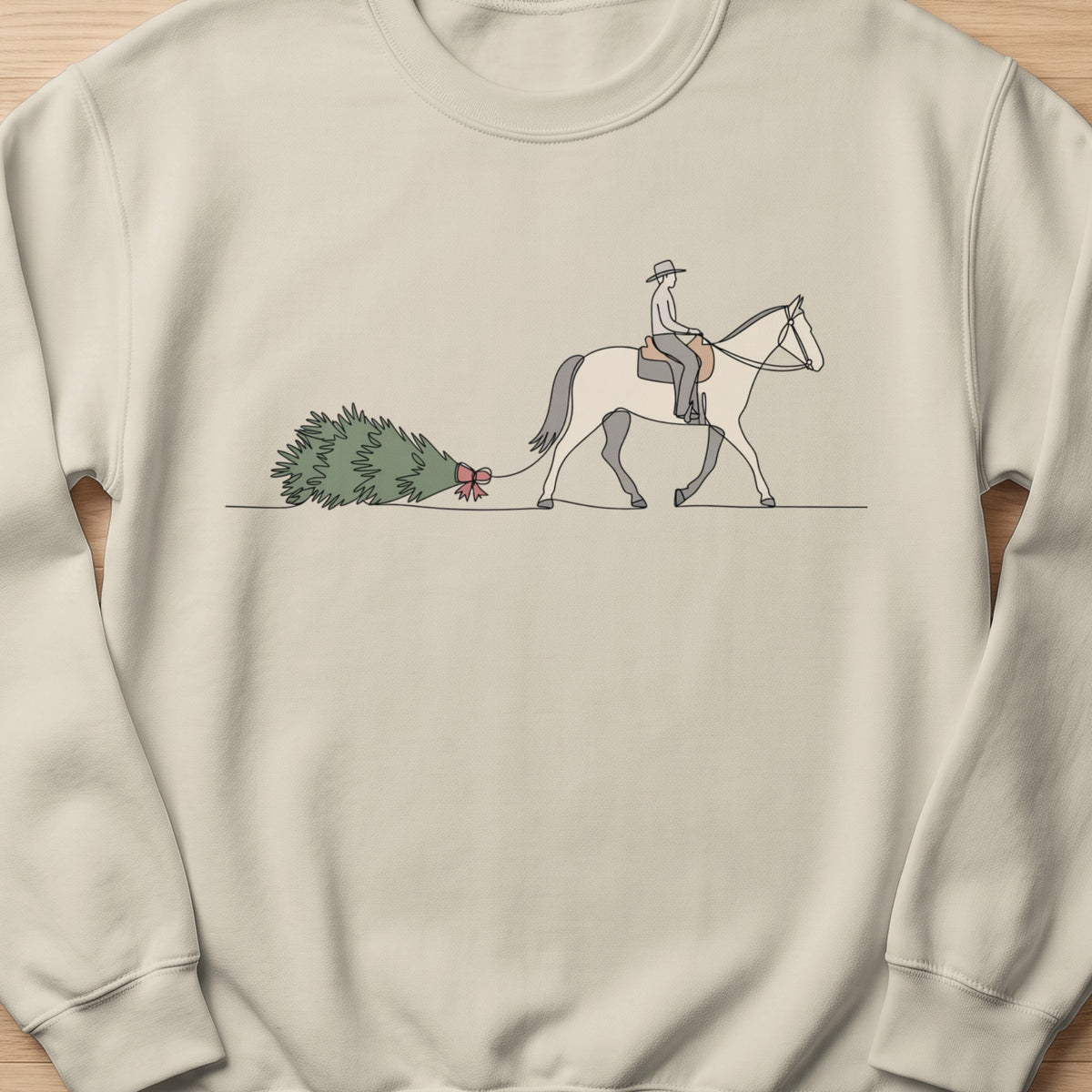 Line art of person riding horse and dragging a Christmas tree with a red bow.