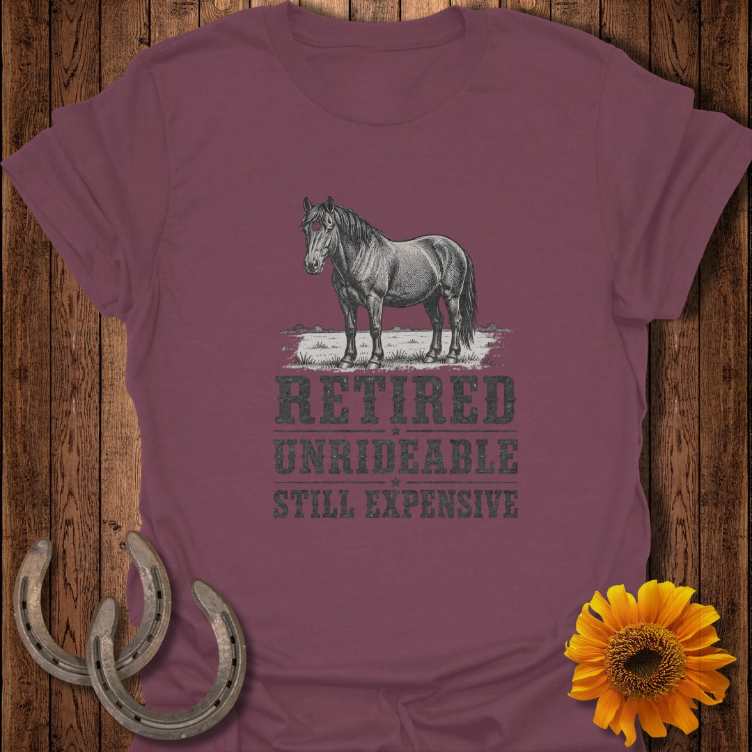 Burgundy t-shirt with vintage horse graphic and text "Retired Unrideable Still Expensive."