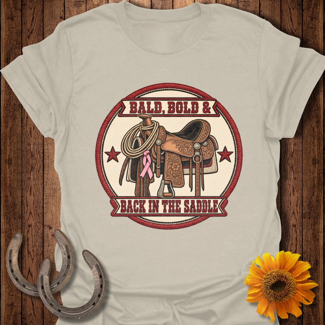 Western saddle with lasso and pink ribbon, reads "Bald, Bold & Back in the Saddle".